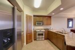 Bright and Open Kitchen with Stainless Steel Appliances 